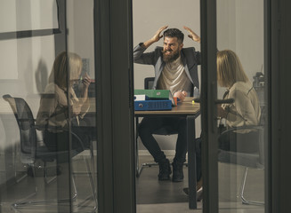 Bearded man shout with anger at woman in office. Bearded man and financier discuss company budget...