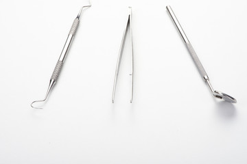 Beautiful metal tool dentist on a white background