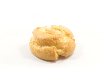 One round yummy profiterole isolated on a white background.