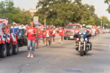 Blurred traditional July 4th parade in Irving, Texas, USA