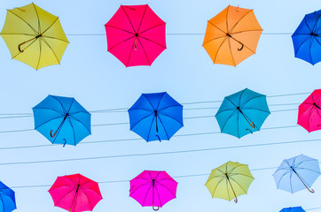 Colorful umbrellas background in the sky. Street decoration.