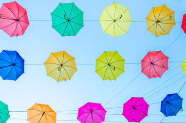 Colorful umbrellas background in the sky. Street decoration.