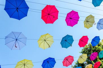 Colorful umbrellas background in the sky. Street decoration.