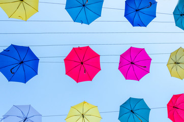 Colorful umbrellas background in the sky. Street decoration.