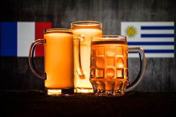 Soccer 2018. Creative concept. Beer glasses with beer on table ready to drink. Support your country with beer concept.