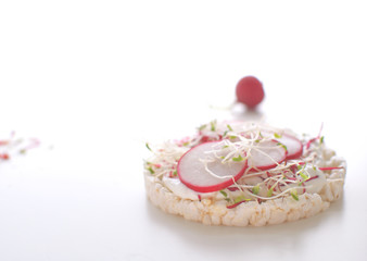 Healthy snack concept Rice bread Crispy bred Radish slices Sprouts Marrow slices Cottage cheese High key Copy space