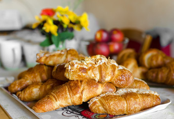 Fresh french croissants on the table, traditional french breakfast