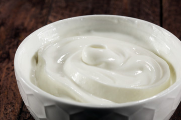 close up of a white whipped or sour cream in bowl.
