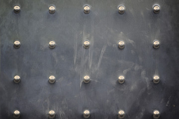 Rivets on a metal clinched veneer. Frame background and empty copy space for Editor's text.