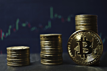 bitcoin coins on crypto currency diagram background