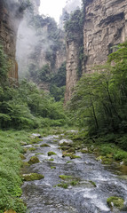 Golden Whip Stream Trail with clouds at Zhangjiajie Natural Forest Park, China