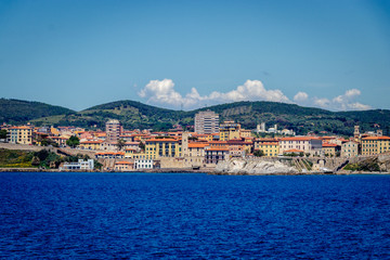 The town of Portoferraio seen from the Ferry coming from Piombino. Portoferraio is a town and comune in the province of Livorno, on the edge of the eponymous harbour of the island of Elba. 