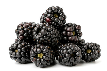 A bunch of ripe blackberries on a white background, close-up.