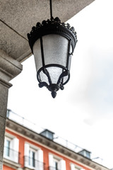 Fototapeta na wymiar Foreground of a beautiful street lamp in the main square of Madrid
