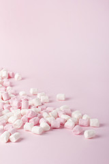 Obraz na płótnie Canvas Colorful marshmallow on pink background. Copyspace.