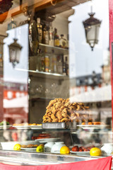 View of typical torreznos from Madrid exhibited in a showcase of a bar