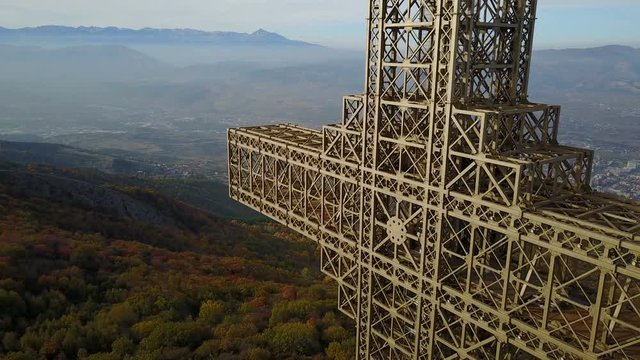 Drone shot of Millennium cross in the mountains above Skopje, constructed as a memorial to 2,000 years of Christianity, in Macedonia