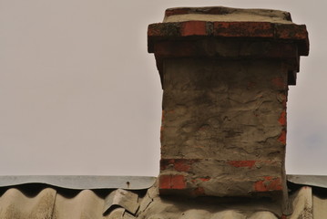 old chimney on the roof of a rural house