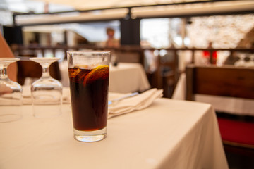 Glass of cold drink in street cafe.