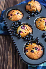 Homemade delicious muffins with fresh berries 
