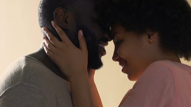Caring wife stroking husband, tender attraction feelings, first sincere love