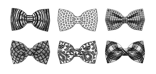 Fototapeta na wymiar The monochrome set of stylish bow ties on a white background.