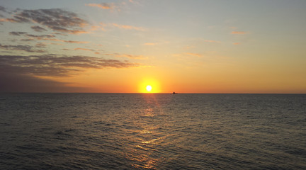 Fototapeta premium Sunrise over the oil towers and offshore oil rigs 
