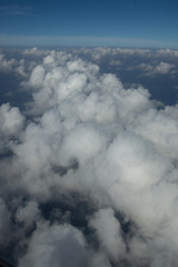 Beautiful white clouds forming and moving in blue sky 