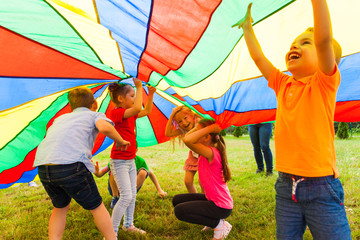 Close up view of children under the huge rainbow cover - 211993191