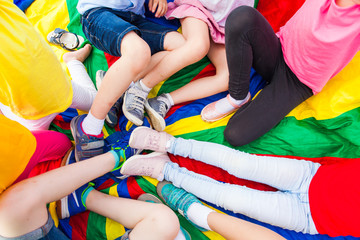 Close view of children's legs in a circle