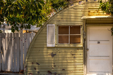 Vintage Quonset hut tiny home building, corrugated metal weather