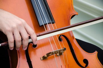 Art and artist. Young elegant man violinist playing violin on black. Classical music. little boy...