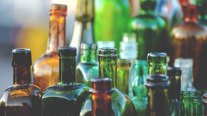 collection of old glass bottles, toned - Powered by Adobe