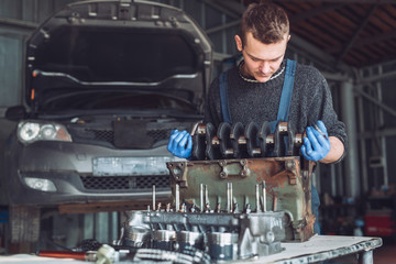 Master collects a rebuilt motor for the car..