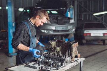 Master collects a rebuilt motor for the car..