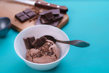 Chocolate sundae ice cream in white bowl, flat lay. Summer seasonal sweets, cold refreshing dessert