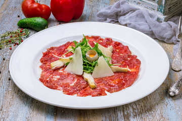 Beef carpaccio with Parmesan and arugula