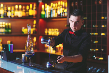 Bartender makes hot cocktail.
