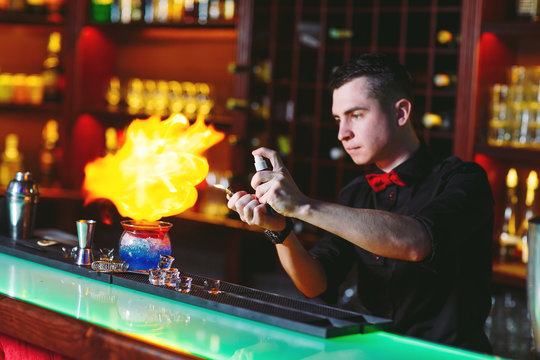 Bartender makes hot cocktail.