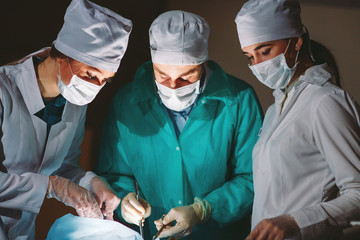 The surgeon makes an operation.