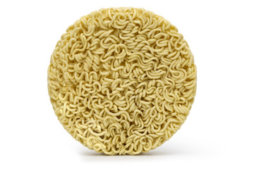 Nests of dried noodles isolated on white background