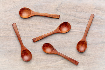 wooden teaspoons on grained wood
