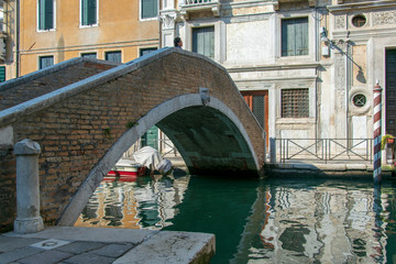 venice bridge across a narrow channel in venice italy