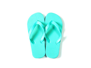 green flip flop over white background