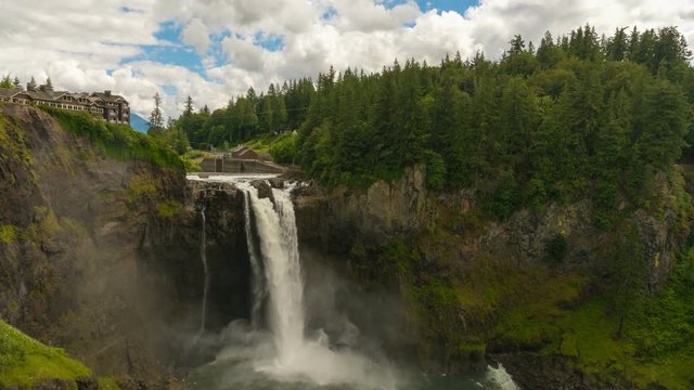 UHD 4k time lapse video of white clouds and blue sky over beautiful Snoqualmie Falls in Washington state one summer day ultra high definition