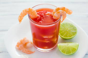 caldo de camaron, consome de camarones, Shrimp cocktail with lemon and salted cookies mexican sea food in mexico