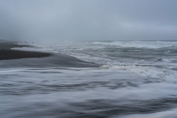 Fototapeta na wymiar majestic seacoast with wavy sea and cliffs, vik dyrholaey, reynisfjara beach, iceland
