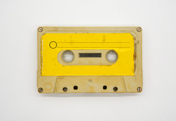 Naklejka premium close up of old and dirty vintage audio tape cassette isolated on white