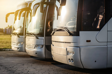 three metallic buses in the parking - obrazy, fototapety, plakaty
