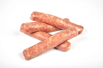 Raw meat sausages isolated on white background